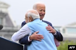US President Joe Biden hugs India's Prime Minister Narendra Modi during a welcoming ceremony for Modi, on the South Lawn of the White House in Washington, DC, on June 22, 2023. (Photo by Mandel NGAN / AFP)