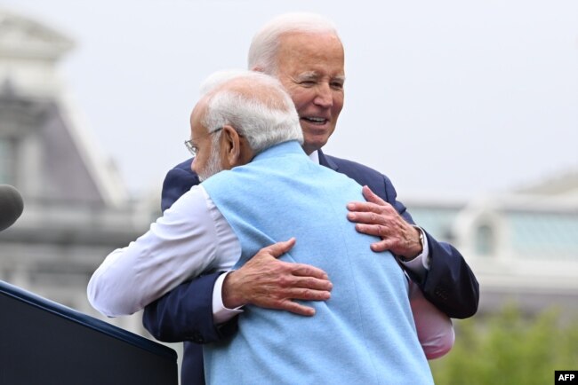 US President Joe Biden hugs India's Prime Minister Narendra Modi during a welcoming ceremony for Modi, on the South Lawn of the White House in Washington, DC, on June 22, 2023. (Photo by Mandel NGAN / AFP)