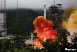A Long March-3B carrier rocket carrying the Beidou-3 satellite, the last satellite of China's Beidou Navigation Satellite System, takes off from Xichang Satellite Launch Center in Sichuan province, China, June 23, 2020.