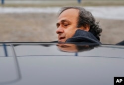 FILE - UEFA President Michel Platini is seen getting into a car in a Jan. 19, 2015, photo.