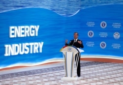 Russian Prime Minister Dmitry Medvedev delivers a speech during a session of the First Caspian Economic Forum in Turkmenbashi, Aug. 12, 2019.