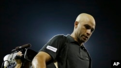 FILE - James Blake leaves the court after being defeated by Ivo Karlovic, of Croatia, in a first round match at the U.S. Open tennis tournament Thursday, Aug. 29, 2013.