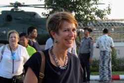 FILE - U.N. Special Envoy for Myanmar Christine Schraner Burgener arrives at Sittwe airport after visiting Maung Daw Township at the Bangladesh-Myanmar border area in Rakhine state, Oct. 15, 2018.