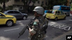 A soldier stands in guard on a street, before a meeting with Brazil's President Michel Temer and local authorities about the implementation of a decree that has placed the military in charge of Rio's state security, at the Guanabara palace in Rio de Janei