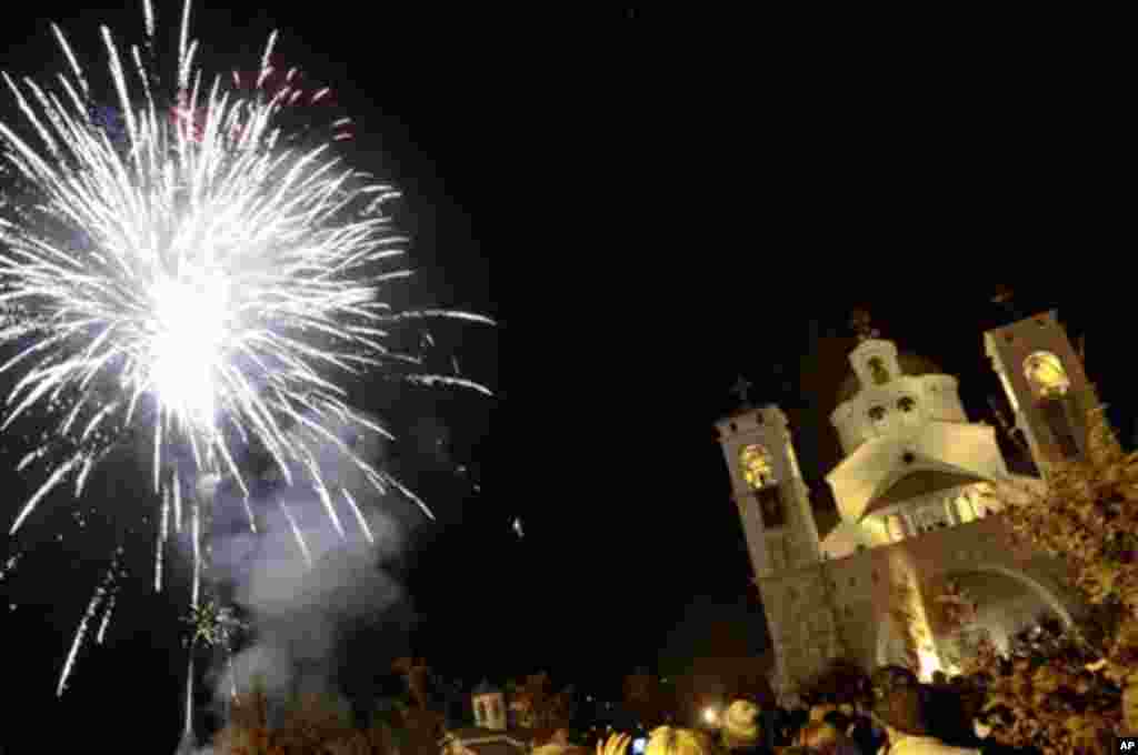 Jan 6: Fireworks illuminate the sky over church of resurrection, in Podgorica, Montenegro. Orthodox Christians in Montenegro celebrate Christmas on Jan. 7, according to the Julian calendar. (Risto Bozovic/AP)