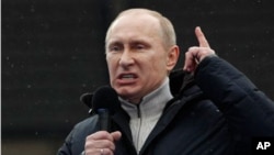Russian Prime Minister Vladimir Putin speaks during a massive rally in his support at Luzhniki stadium in Moscow, February. 23, 2012.