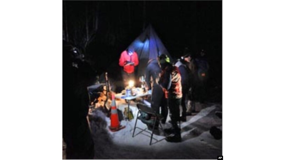 Competitors at Ski Pulk, the last checkpoint, 110 miles (177 km) into the race.