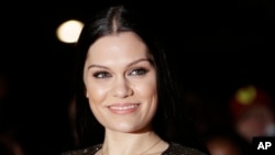 Jessie J poses for photographers upon arrival at the Mobo Awards, in central London, Oct. 22, 2014. 