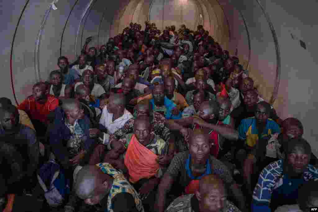 Hundreds of volunteers sit on a plane heading for a training center after answering Democratic Republic of Congo&#39;s President Felix Tshisekedi&#39;s call to join the army to fight against the M23 rebellion in Goma, Nov. 14, 2022.