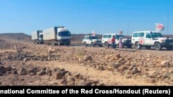 A convoy of trucks from the International Committee of the Red Cross (ICRC) are seen delivering lifesaving medical supplies on the road to Mekelle, in Tigray region, Ethiopia, Nov. 15, 2022.
