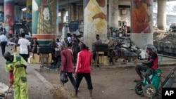 People walk during rush hours in Lagos, Nigeria, Nov. 14, 2022.