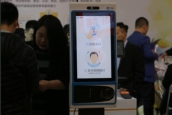 A machine with Alipay's facial recognition payment system is displayed at a smart business fair in Nanjing, Jiangsu province, China, March 21, 2019.