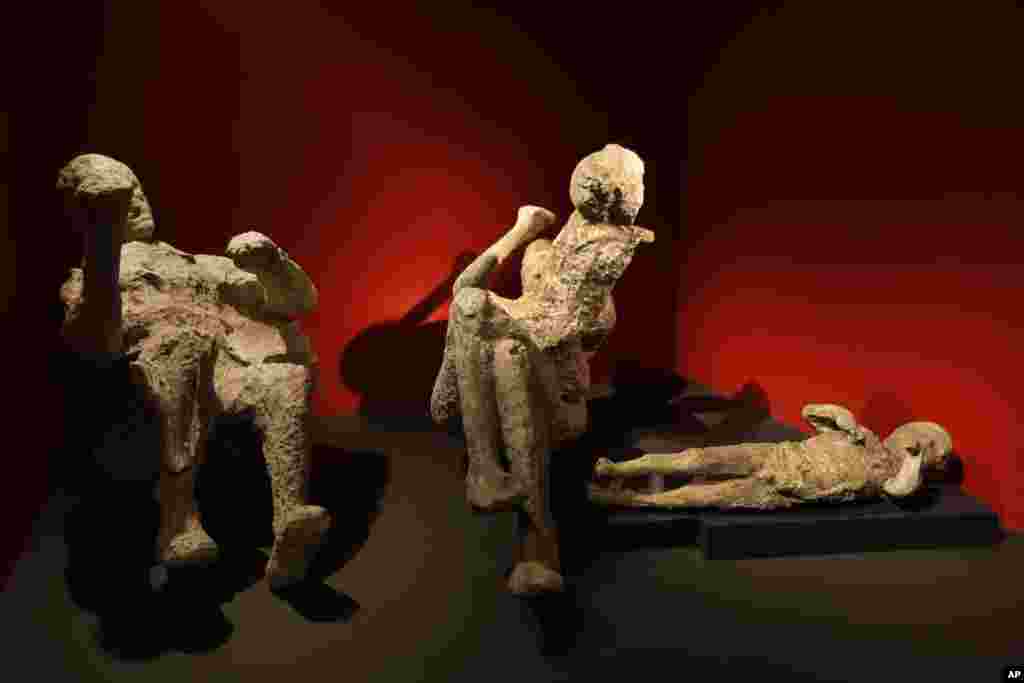 Casts of a family of two adults and two children who died together in an alcove in Pompeii are seen during a photo call for the upcoming exhibition entitled &#39;Life and death Pompeii and Herculaneum&#39; at the British Museum in central London.