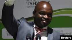 Solly Msimanga waves to his supporters after being officially installed as the mayor for the City of Tshwane, South Africa, Aug. 19, 2016.