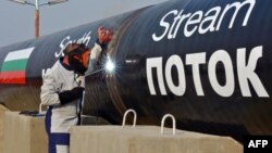 FILE - A picture taken Oct. 31, 2013 shows a worker welding pipes during the symbolic start of the construction of the Bulgarian section of Russian gas giant Gazprom's South Stream pipeline near the village of Rasovo.