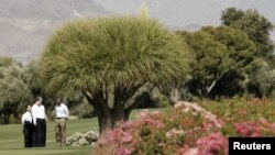 and Chinese President Xi Jinping talk as they tour the grounds at The Annenberg Retreat at Sunnylands in Rancho Mirage, California June 8, 2013. 