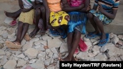 Girls sit in the yard at Kalas Girls Primary School, Amudat District, Karamoja, Uganda, Jan. 31, 2018. They each escaped home after their families tried to force them to undergo FGM or to enter into marriage. 