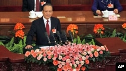 Chinese Premier Wen Jiabao delivers the government report at the opening session of the annual National People's Congress in the Great Hall of the People in Beijing, March 5, 2011