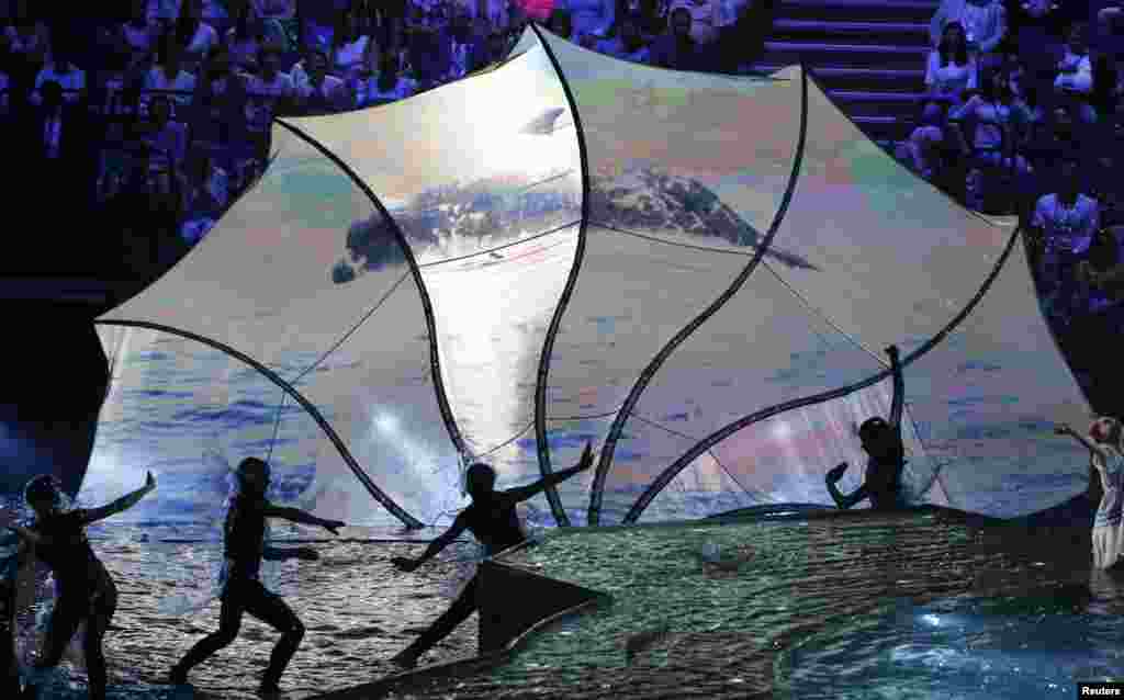 Performers dance during the opening ceremony for the 16th FINA World Championships in Kazan, Russia.