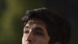 In this undated photo provided by MacKenzie Coffman, Axel Lopez sits on the University of California, Los Angeles campus.