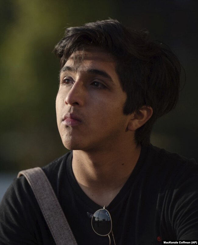 In this undated photo provided by MacKenzie Coffman, Axel Lopez sits on the University of California, Los Angeles campus.