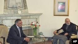 Afghanistan's President Hamid Karzai (R) meets with U.S. Secretary of Defense Leon Panetta in Kabul, March 15, 2012.