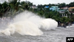 Large waves break along a seawall ahead of the expected landfall of Super Typhoon Man-yi, in Legaspi City, Albay province, Philippines, on Nov. 16, 2024.