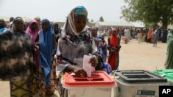 FILE: A woman cast her votes during the presidential and National Assembly elections in Damilu Yola, Nigeria, Feb. 23, 2019.