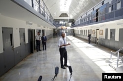 FILE - U.S. President Barack Obama, the first sitting president to visit a federal prison, speaks during his visit to the El Reno Federal Correctional Institution outside Oklahoma City, July 16, 2015.