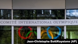 The Olympic Rings are displayed at the entrance of the IOC, International Olympic Committee headquarters during the coronavirus disease (COVID-19) outbreak in Lausanne, Switzerland, Tuesday, March 24, 2020.