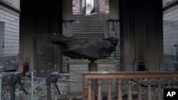 A meteorite on exhibit is seen inside the entrance of the National Museum after an overnight fire in Rio de Janeiro, Brazil, Sept. 3, 2018.