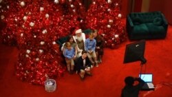 Children dressed up for photoshoot with Santa at Macy’s Department Store, December 18, 2021, Springfield, Virginia.