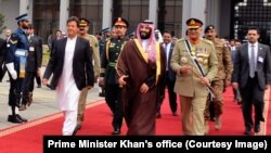 Saudi Crown Prince Mohammd bin Salmand is seen off by Prime Minister Khan, left, and Army chief, Gen. Qamar Bajwa, right, at Islamabad's Nur Khan Air Force base, Pakistan, Feb. 18, 2019.