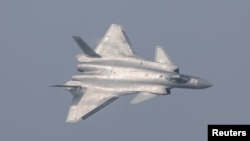China unveils its J-20 stealth fighter during an air show in Zhuhai, Guangdong Province, China, Nov. 1, 2016. Military planes from China have increasingly skirted the island of Taiwan.