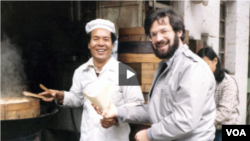 VOA correspondent Al Pessin, shown with an unidentified vendor, covered China during the Tiananmen Square. He appears in a video from the U.S.-China Institute.