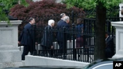 Senate Majority Leader Mitch McConnell (center) and other senators walk to an all-Senators briefing on the situation in the Korean Pensinsula, April 26, 2017, at the Eisenhower Executive Office Building on the White House complex in Washington.