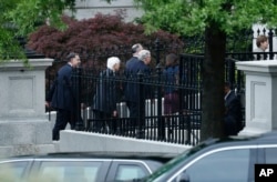 Senate Majority Leader Mitch McConnell., center, and other senators walk to an all-Senators briefing on the situation in the Korean Pensinsula, April 26, 2017, at the Eisenhower Executive Office Building on the White House complex in Washington.