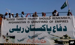 FILE - A leader of the Pakistan Defense Council, an alliance of hard-line Islamist religious leaders and politicians, speaks during an anti-U.S. rally in Islamabad, Pakistan, Aug. 27, 2017. Pakistan's political, religious and military leaders rejected President Donald Trump's allegation that Islamabad was harboring militants who battle U.S. forces in Afghanistan.