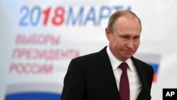 FILE - Russian President Vladimir Putin arrives to vote during Russia's presidential election in Moscow, March 18, 2018. Putin won another six-year term.