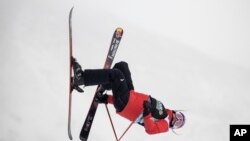 Eileen Gu, of China, makes a run in the slopestyle finals, Dec. 17, 2021, during the Dew Tour freestyle skiing event at Copper Mountain, Colo.