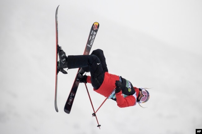 Eileen Gu, of China, makes a run in the slopestyle finals, Dec. 17, 2021, during the Dew Tour freestyle skiing event at Copper Mountain, Colo.