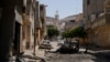 A view of destroyed buildings and cars after the street was controlled by forces loyal to Libyan commander Khalifa Haftar in Derna, Libya, June 13, 2018. 