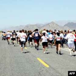 Police officers and other law enforcement professionals run through the Mojave Desert from Baker, California, to Las Vegas