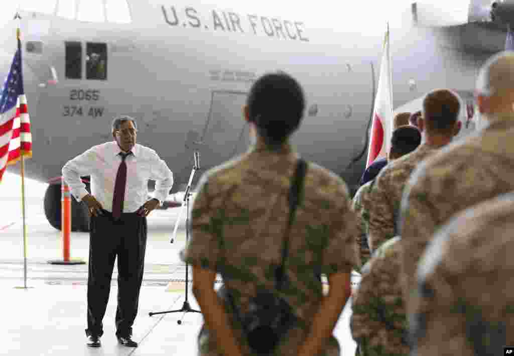 U.S. Secretary of Defense Leon Panetta, left, listens to a question from U.S. military personnel stationed at Yokota Air Base in Yokota, Japan, September 17, 2012. 