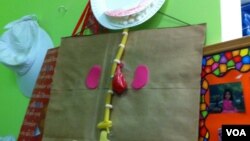 Reusable bags hang on hooks in the classroom at St. James school in Potomac, Maryland (Photo: VOA / K. Amkas)