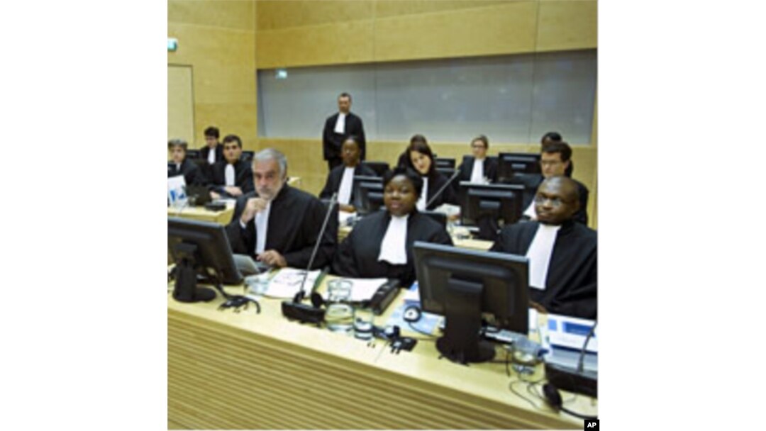Luis Moreno-Ocampo (front C) and other members of the Office of the Prosecutor attend the hearing of of Francis Muthaura, Uhuru Kenyatta and Mohammed Hussein Ali at the International Criminal Court (ICC) in The Hague, September 21, 2011