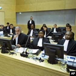 Luis Moreno-Ocampo (front C) and other members of the Office of the Prosecutor attend the hearing of of Francis Muthaura, Uhuru Kenyatta and Mohammed Hussein Ali at the International Criminal Court (ICC) in The Hague, September 21, 2011