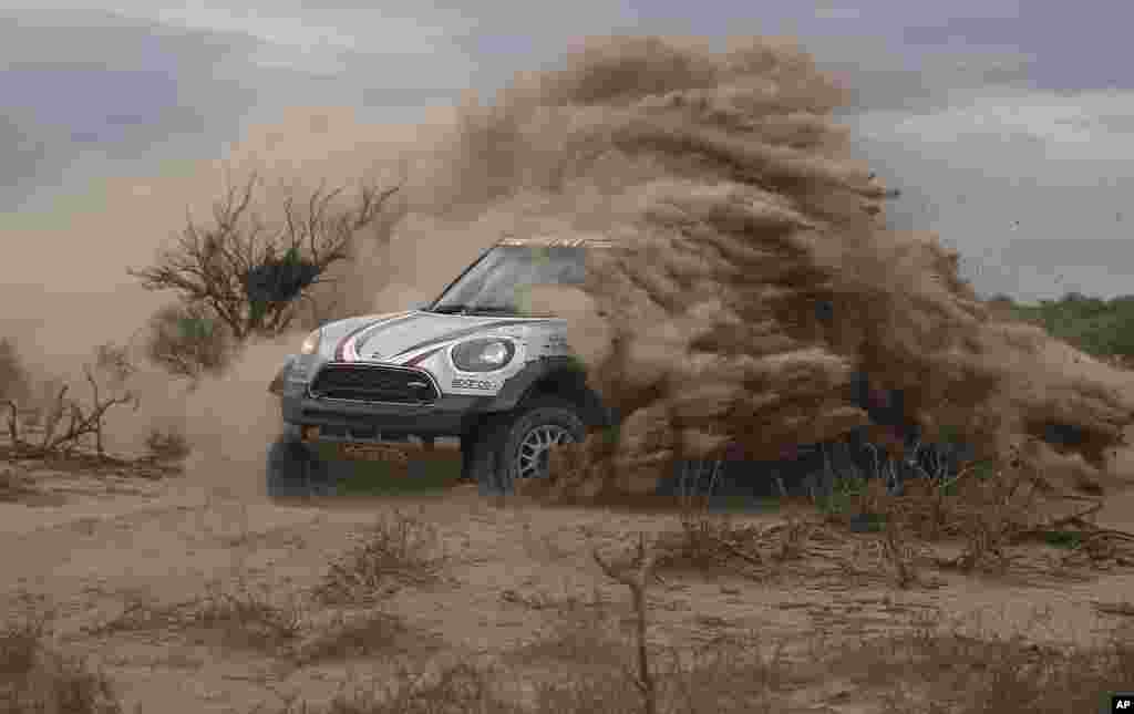 Driver Orlando Terranova of Argentina and co-driver Andreas Schulz of Germany race their Mini during the 11th stage of the Dakar Rally, between San Juan and Rio Cuarto, Argentina.