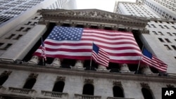 US flag flies from the New York Stock Exchange in New York, August 5, 2011