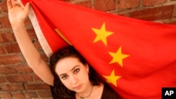 FILE - American Melissa Sconyers, who studied abroad in China, poses with Chinese flag in San Francisco.